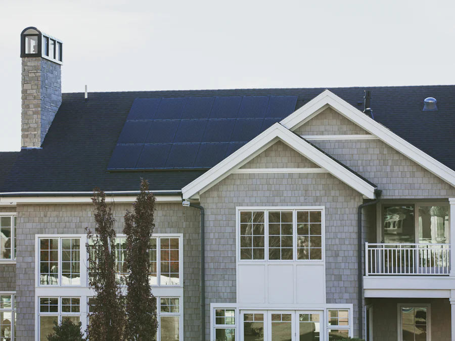 Gray family home with solar panels on the roof