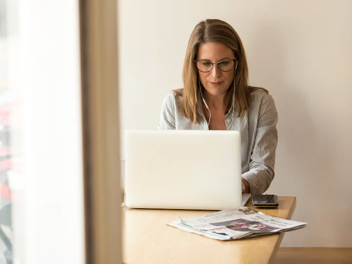 Homeowner filling in a form on a laptop