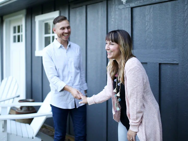 Solar advisor greeting a homeowner at the front door
